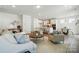 Open-concept living space featuring a kitchen with an island and a dining area at 8230 Verona Rd # 80, Charlotte, NC 28213