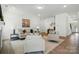 Open-concept living room with hardwood floors, neutral décor, and plenty of natural light at 8230 Verona Rd # 80, Charlotte, NC 28213