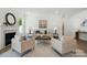 Spacious living room with a fireplace, hardwood floors, and plenty of seating at 8230 Verona Rd # 80, Charlotte, NC 28213