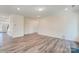 Light-filled living room with hardwood floors and fireplace at 8230 Verona Rd # 80, Charlotte, NC 28213