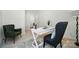 Stylish home office setup featuring a white desk, comfortable chairs, and bright, neutral decor at 8230 Verona Rd # 80, Charlotte, NC 28213