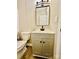 Vanity with sink and mirror in updated bathroom at 9763 Knightbridge Dr, Concord, NC 28025