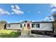 Mobile home with new wooden stairs and landscaping at 9763 Knightbridge Dr, Concord, NC 28025