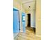 Light-filled hallway with light blue doors and wood-look flooring at 9763 Knightbridge Dr, Concord, NC 28025