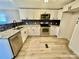 Modern kitchen with white cabinets and granite counters at 9763 Knightbridge Dr, Concord, NC 28025