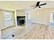 Living room with fireplace and vinyl plank flooring at 9763 Knightbridge Dr, Concord, NC 28025