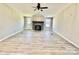 Spacious living room with fireplace and ceiling fan at 9763 Knightbridge Dr, Concord, NC 28025