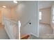 Upstairs hallway with white railing, carpet, and view of bedroom at 11316 Vista Canyon Dr, Charlotte, NC 28226