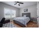 Bright bedroom featuring a comfortable bed and hardwood floors at 1533 Weatherwood Dr, Lincolnton, NC 28092