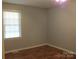 Simple bedroom with a large window provides lots of light and neutral ambiance at 1857 Williams Cir, Lancaster, SC 29720