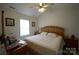 Spacious bedroom with king-size bed and ceiling fan at 2038 Mallard Creek Dr, Rock Hill, SC 29732
