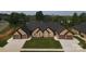 Beautiful duplex featuring brick facade, attached garages, and well-manicured lawn creating a welcoming curb appeal at 3341 48Th Ne Ave # 15A, Hickory, NC 28601