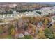 Expansive aerial view showcases a neighborhood with lush foliage in fall colors and well-maintained homes at 4739 Whispering Oaks Dr, Charlotte, NC 28213