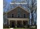 Charming new construction two-story home with a covered porch and brick facade at 4739 Whispering Oaks Dr, Charlotte, NC 28213