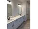Modern main bathroom with double sinks, white cabinetry and new fixtures at 6319 Honor Ave, Midland, NC 28107