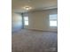 Spacious main bedroom with wall-to-wall carpet and large windows at 6319 Honor Ave, Midland, NC 28107