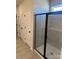 Modern bathroom featuring a glass enclosed shower with grey tile and a built in seat at 6319 Honor Ave, Midland, NC 28107