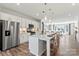 Modern kitchen with island, stainless steel appliances, and hardwood floors at 7108 Brookview Ln, Sherrills Ford, NC 28673