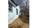 Side view of the house, showcasing new paint and landscaping at 815 Jefferson St, Shelby, NC 28150