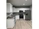 Modern kitchen featuring white cabinets and granite countertops at 815 Jefferson St, Shelby, NC 28150