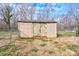 Tan wooden storage shed with double doors in backyard at 108 Landing Ct # 36, Bessemer City, NC 28016