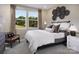 Serene bedroom with large windows offering scenic views and a comfortable seating area at 1432 Mccollum N St, Monroe, NC 28112