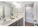 This is a bathroom with double sinks, modern fixtures, and a separate shower and bathtub at 1447 Honey Trl, Monroe, NC 28112