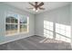 Well-lit bedroom with ceiling fan and grey carpet at 1630 Hardy Dr, Rock Hill, SC 29732