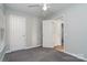 Well-lit bedroom with two doors and neutral walls at 1630 Hardy Dr, Rock Hill, SC 29732