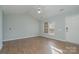 Spacious living area with light walls and hardwood floors at 1630 Hardy Dr, Rock Hill, SC 29732