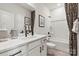 Neutral bathroom features a modern vanity and tub with shower, accented by stylish black and white patterns at 1746 Blanche St, Charlotte, NC 28262