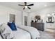 Stylish bedroom featuring a dresser with a round mirror and a walk-in closet for ample storage space at 1746 Blanche St, Charlotte, NC 28262