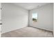 Well-lit bedroom featuring neutral walls, carpet and a window offering landscape views at 1750 Blanche St, Charlotte, NC 28262