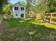 A shot of the large backyard, grass and a newly built privacy fence enclosing the property at 211 Chestnut St, Shelby, NC 28150