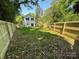 An expansive backyard with a well maintained lawn, enclosed by a new privacy fence at 211 Chestnut St, Shelby, NC 28150