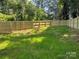Spacious backyard featuring a lush lawn enclosed by a newly constructed wooden fence at 211 Chestnut St, Shelby, NC 28150