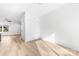 Bedroom featuring wood-look floors, closet, and view of kitchen at 211 Chestnut St, Shelby, NC 28150