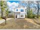 Charming two-story home with a modern mailbox, bright curb appeal, and landscaping at 211 Chestnut St, Shelby, NC 28150