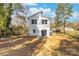 Home exterior showcasing backyard patio access and manicured green space at 211 Chestnut St, Shelby, NC 28150