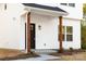 Front entrance of a new construction home with wood columns at 211 Chestnut St, Shelby, NC 28150