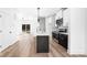 Kitchen with center island, stainless appliances, and sliding glass door to backyard at 211 Chestnut St, Shelby, NC 28150