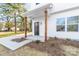 Cozy front porch with stained wood columns, modern lighting, and a welcoming entrance at 211 Chestnut St, Shelby, NC 28150