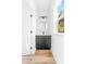 Powder room with black vanity, black faucet, and window at 211 Chestnut St, Shelby, NC 28150