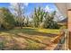 Large backyard with mature trees and grassy area at 223 W 9Th St, Newton, NC 28658