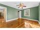 Spacious bedroom with hardwood floors and ceiling fan at 223 W 9Th St, Newton, NC 28658