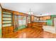 Bright dining area with built-in shelving and hardwood floors at 223 W 9Th St, Newton, NC 28658