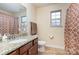 Bathroom with granite countertop, shower, and updated fixtures at 2548 Flintshire Ln, Gastonia, NC 28056