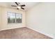 Bright bedroom with a ceiling fan, window blinds, and neutral colored carpet at 2548 Flintshire Ln, Gastonia, NC 28056