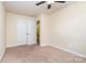 Well-lit bedroom featuring neutral walls, carpet, and double doors at 2548 Flintshire Ln, Gastonia, NC 28056