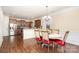 Dining area adjacent to kitchen with hardwood floors at 2548 Flintshire Ln, Gastonia, NC 28056